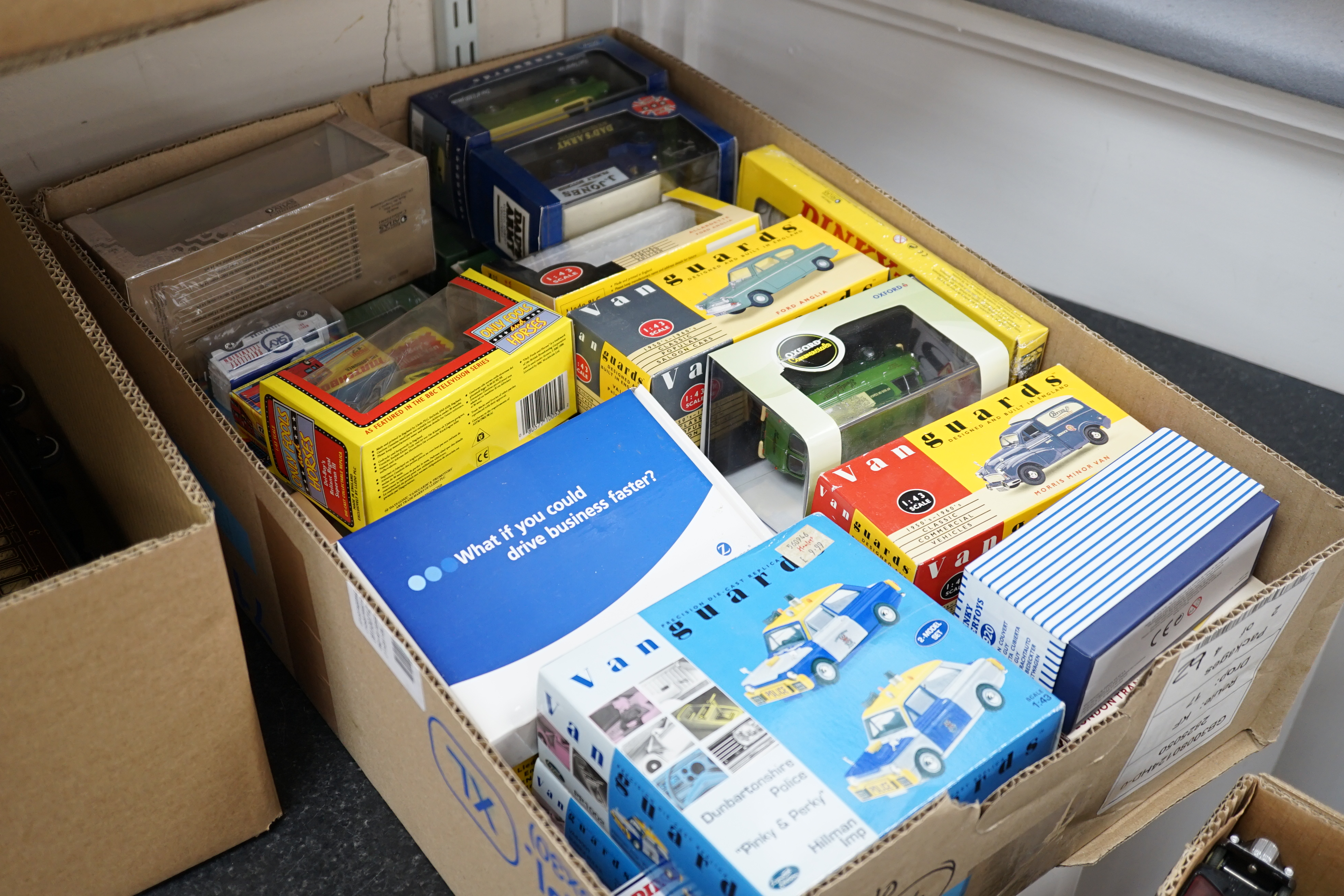 Thirty-six boxed diecast vehicles by Vanguard, Atlas Dinky, Revell, etc. including; cars, commercial vehicles, police cars, TV related cars, an Action 1:32 scale UPS van, four Jet Age military aircraft, etc. together wit